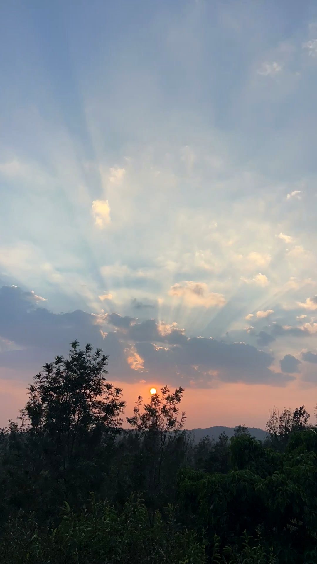Valley sunset with sun rays